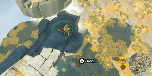 緑色の足場から下の湖に向かって飛び込む